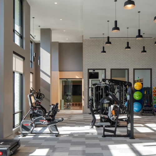 Treadmills and medicine balls in Aspire Huntington Station's fitness center