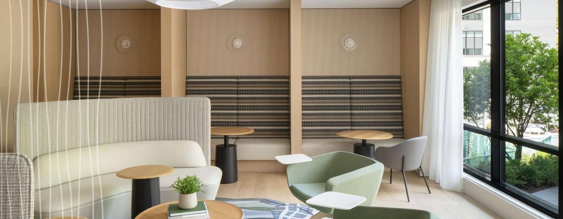 a room with a couch and chairs